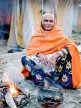 80 yr old Devotee on Kalpa-vaas (period stay). Many stay in the tents with rents around Rs 2500-3000/mnth and cook their own food and go for a dip every morning at 5 and spend the day in Sadhana and Puja