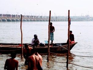 A few boats were picking up the offerings from the water to clean up as people kept offering to the Ganges