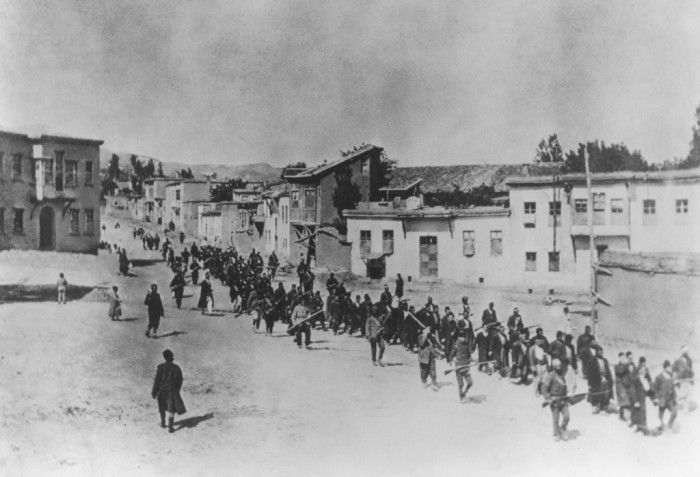 <p>Ottoman military forces march Armenian men from Kharput to an execution site outside the city. Kharput, Ottoman Empire, March 1915-June 1915. [Courtesy of the Armenian National Institute.]</p>
